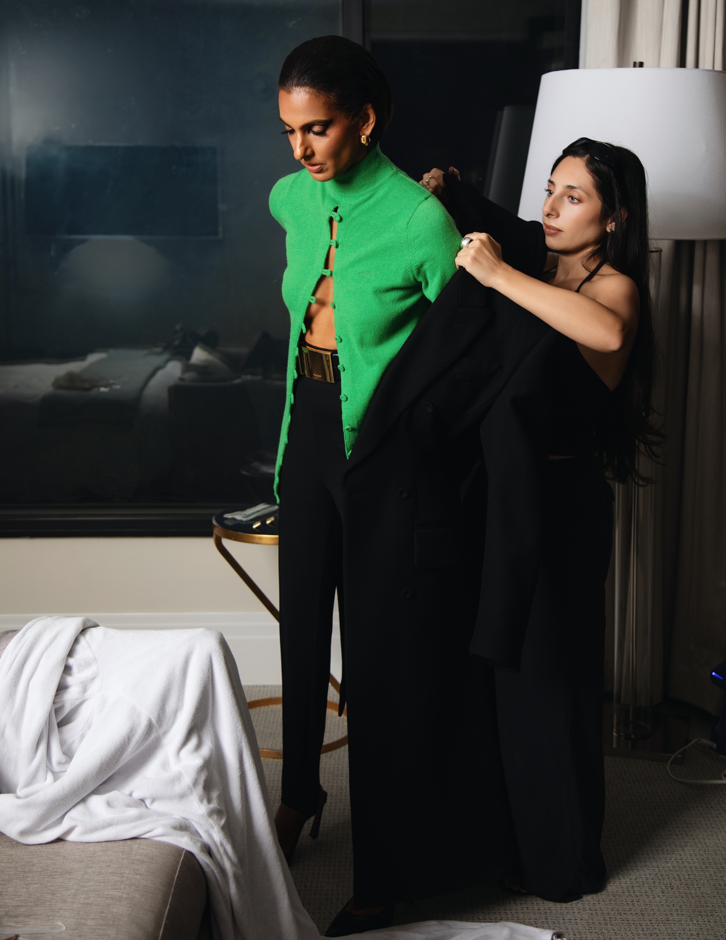 Poorna Jagannathan getting ready for the premiere of 'Lanterns' in L.A., wearing a black-and-green cool from Mugler.