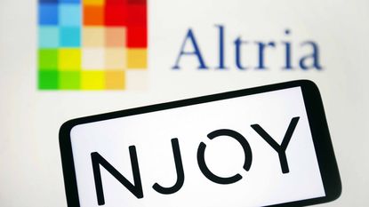 altria logo in background with njoy logo on smartphone