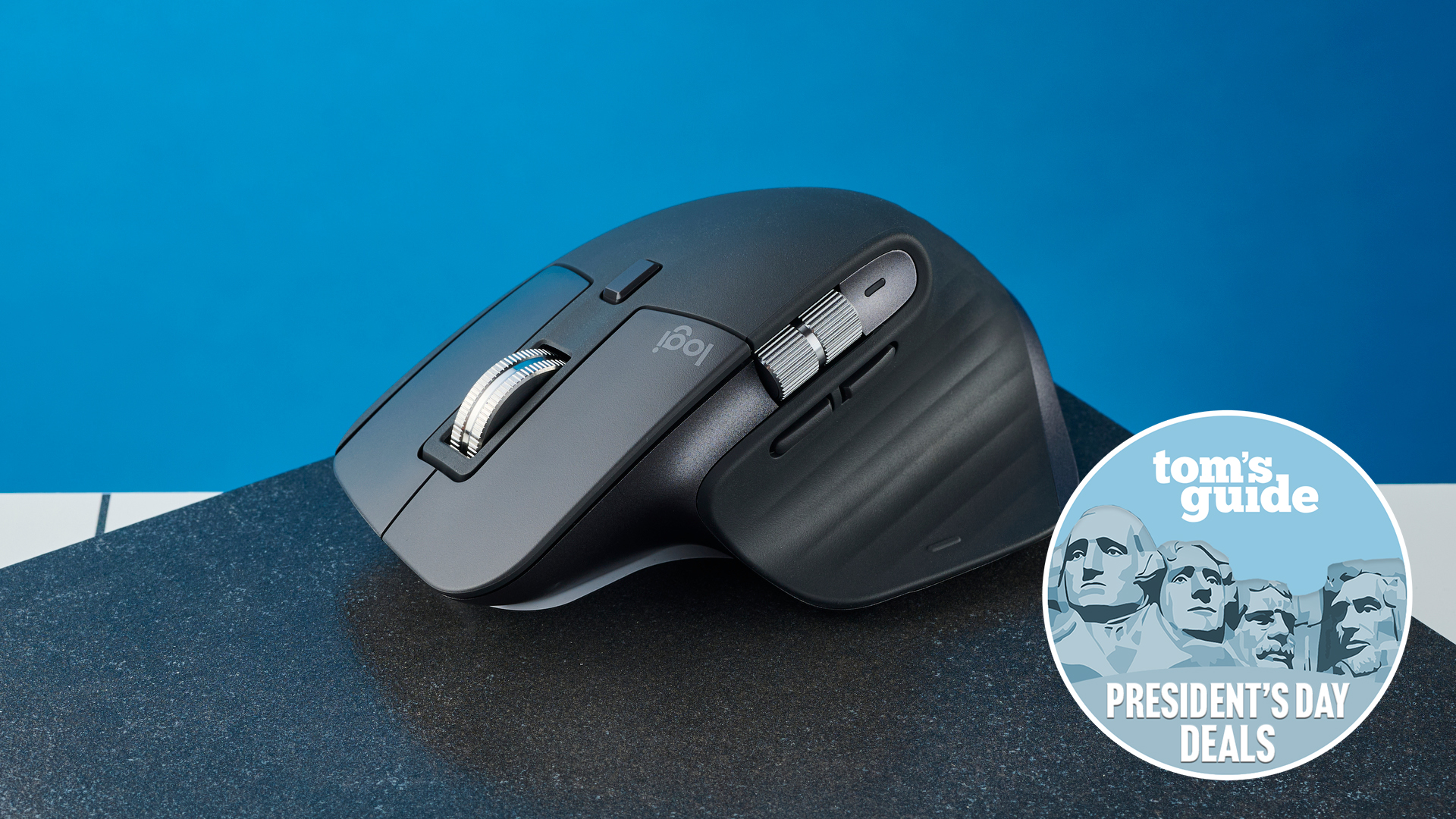Logitech MX Master 3S on a black slate with a blue background