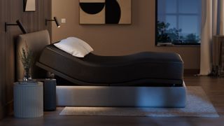 An Eight Sleep mattress on a bed in a warmly lit bedroom