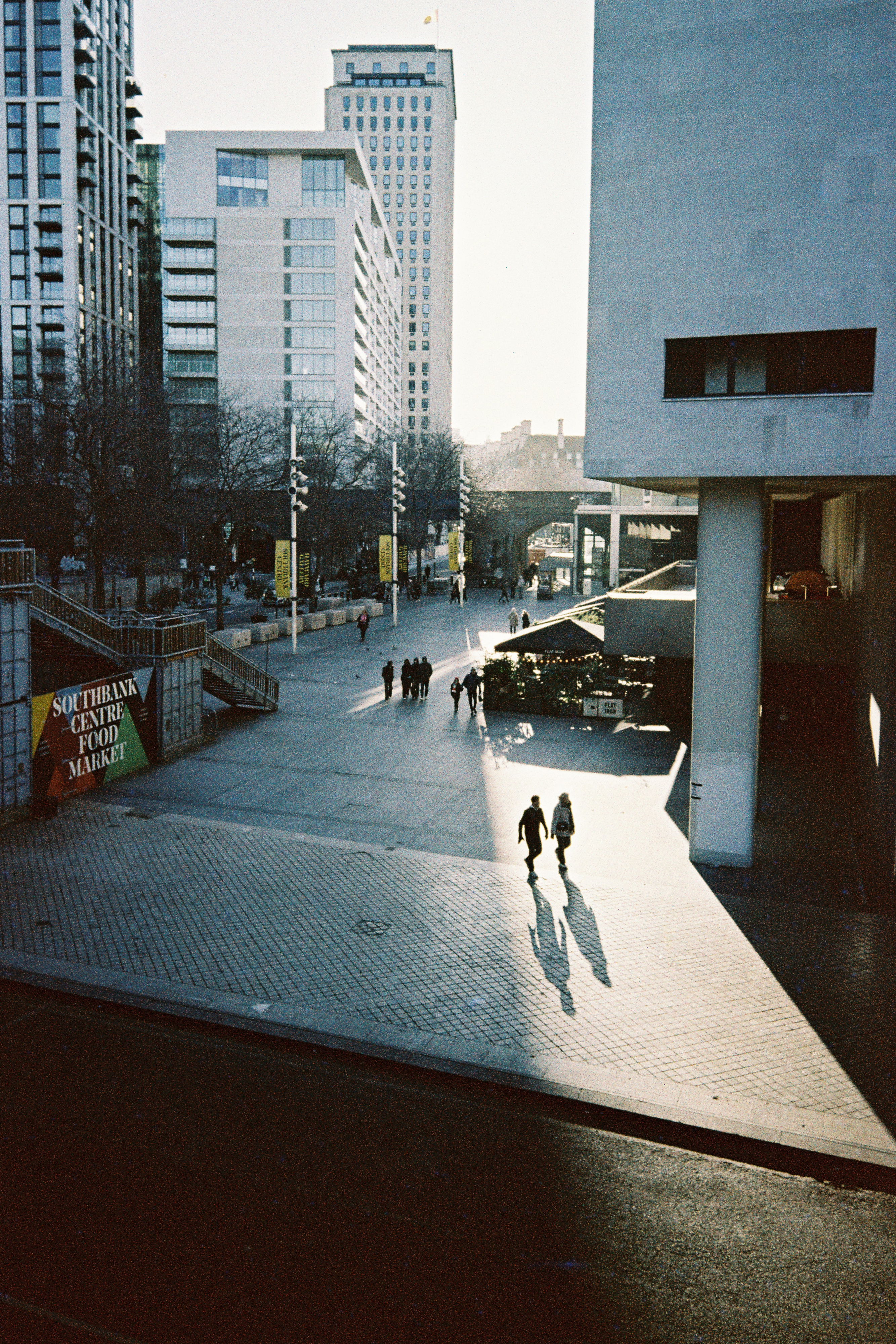 Sample photograph taken with Kodak Snapic A1, showing people walking in sunlight outside Southbank centre