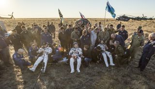 NASA astronaut Jeff Williams (left) and Russian cosmonauts Oleg Skripochka and Alexey Ovchinin on the steppe of Kazakhstan after landing safely on Sept. 6, 2016.