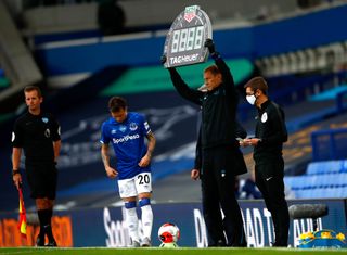 Everton assistant manager Duncan Ferguson holds up the substitutes board
