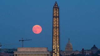 A full moon, known as a Harvest Moon, rises over Washington, D.C., on Sept. 19, 2013.