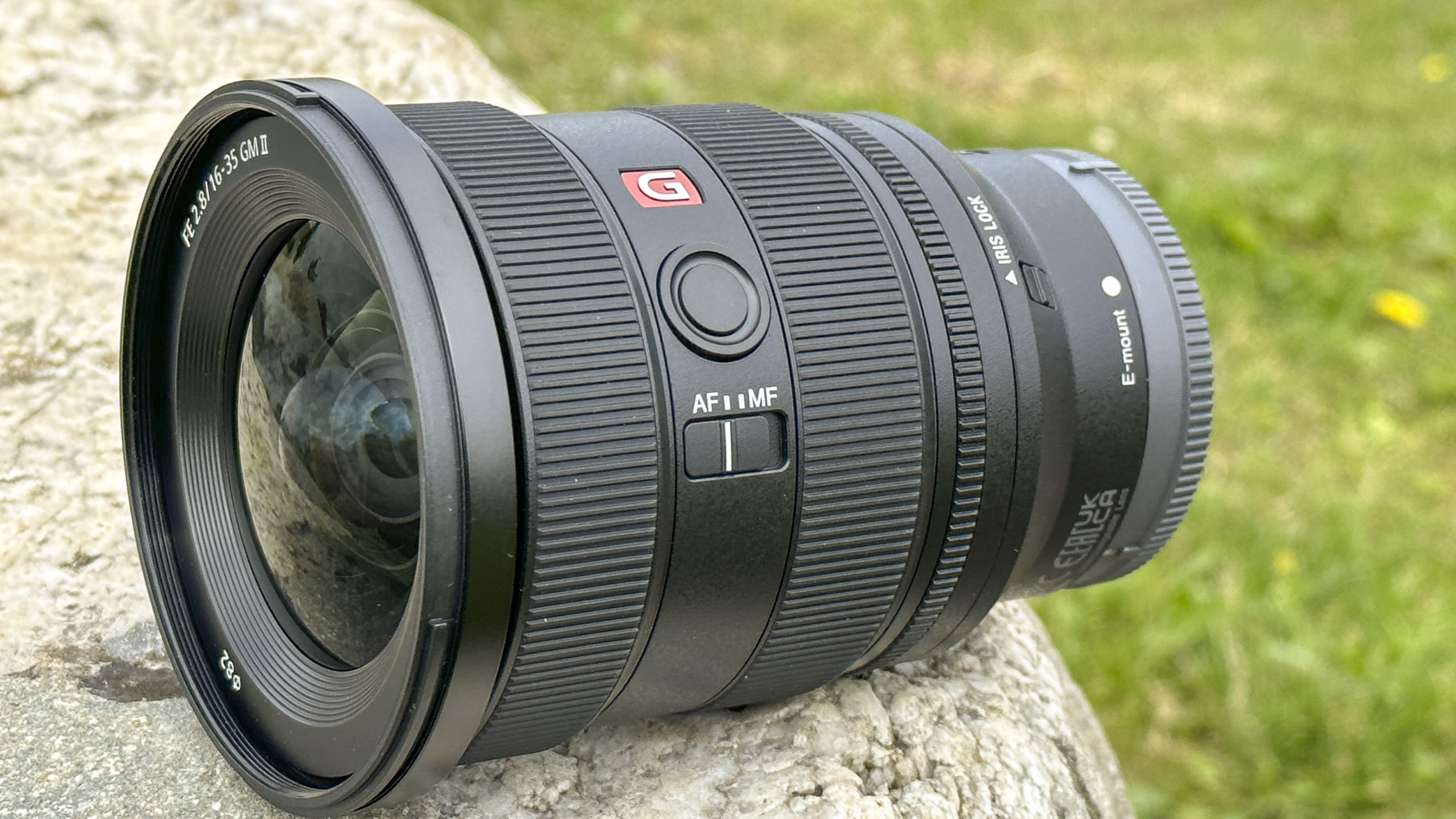 Sony FE 16-35mm F2.8 GM II lens outdoors on a rock