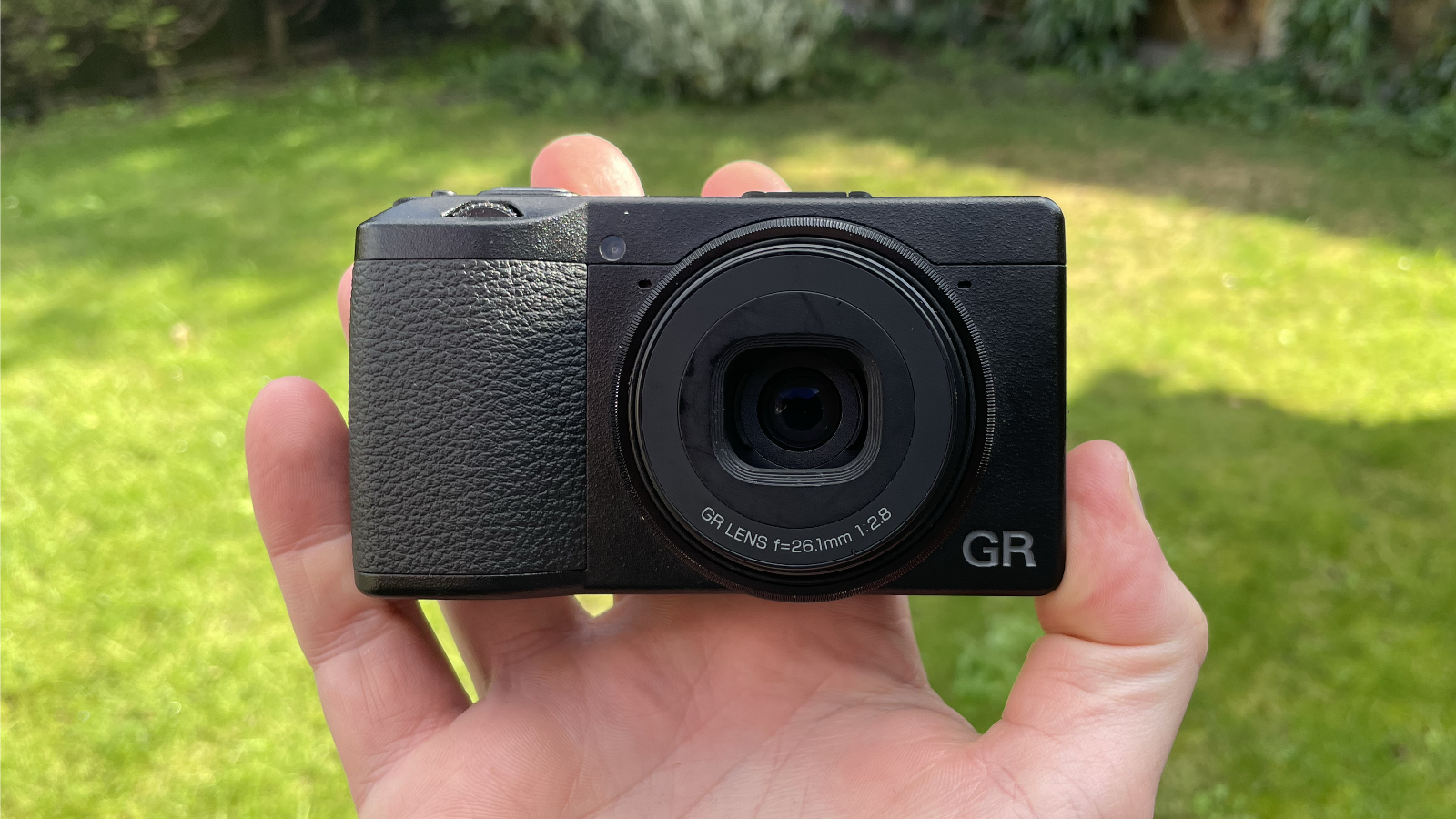 Ricoh GR IIIx HDF compact camera in hand