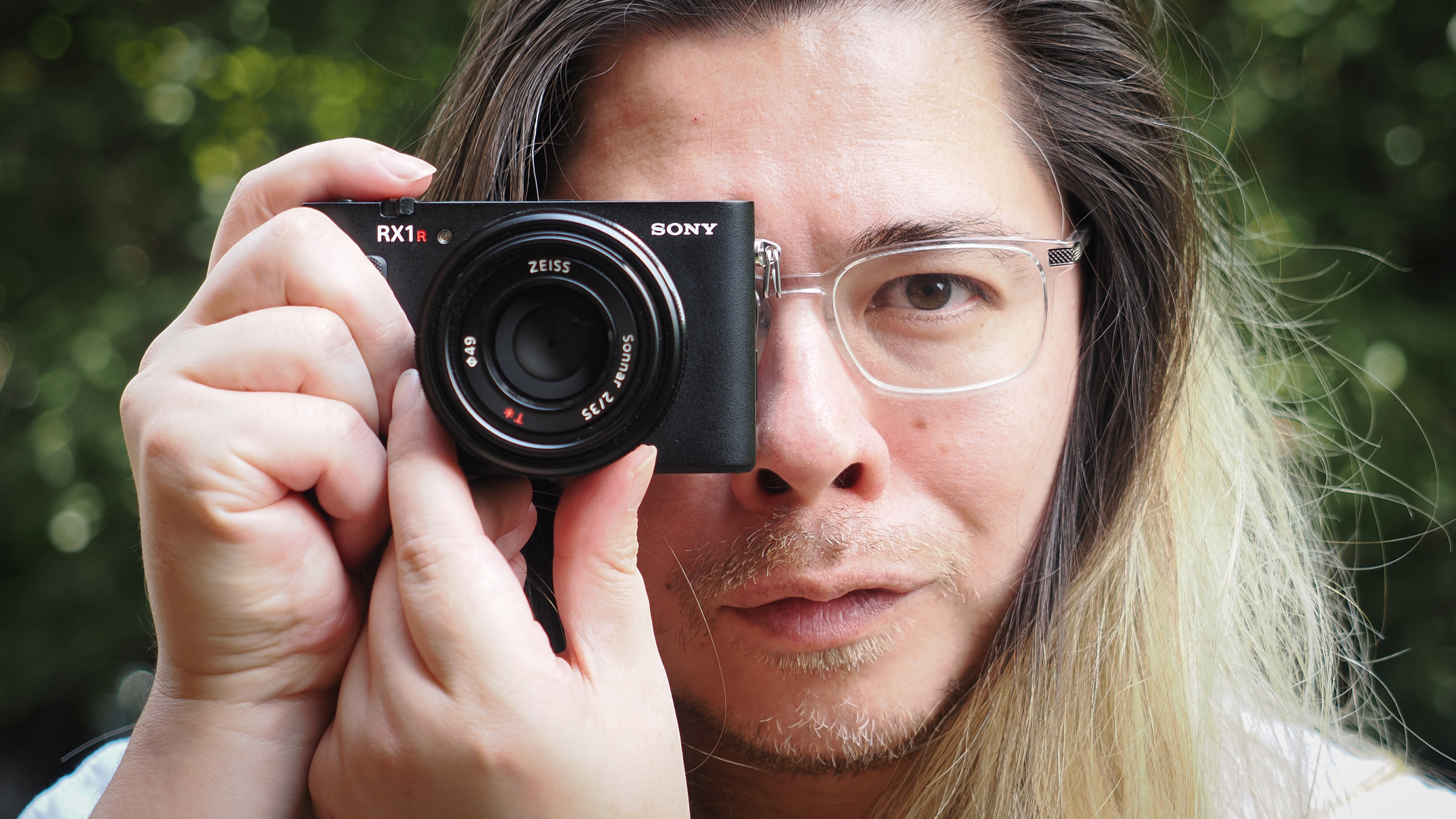 Photographer James Artaius holding the Sony RX1R III camera outdoors