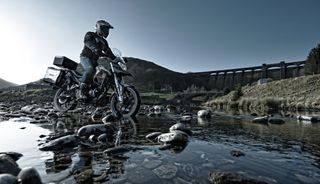 Motorcycle rider going through water