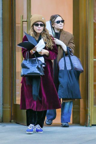 The Olsen twins wear matching outfits in New York.
