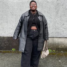 Lydia Okello wearing all black outfit in 2025