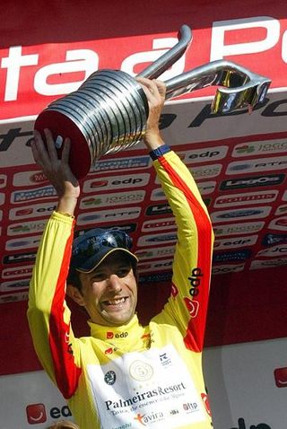 2008 Volta a Portugal winner David Blanco celebrates on the podium.