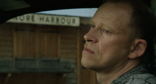 Justin, played by Robert Webb, look moody in Death in Paradise