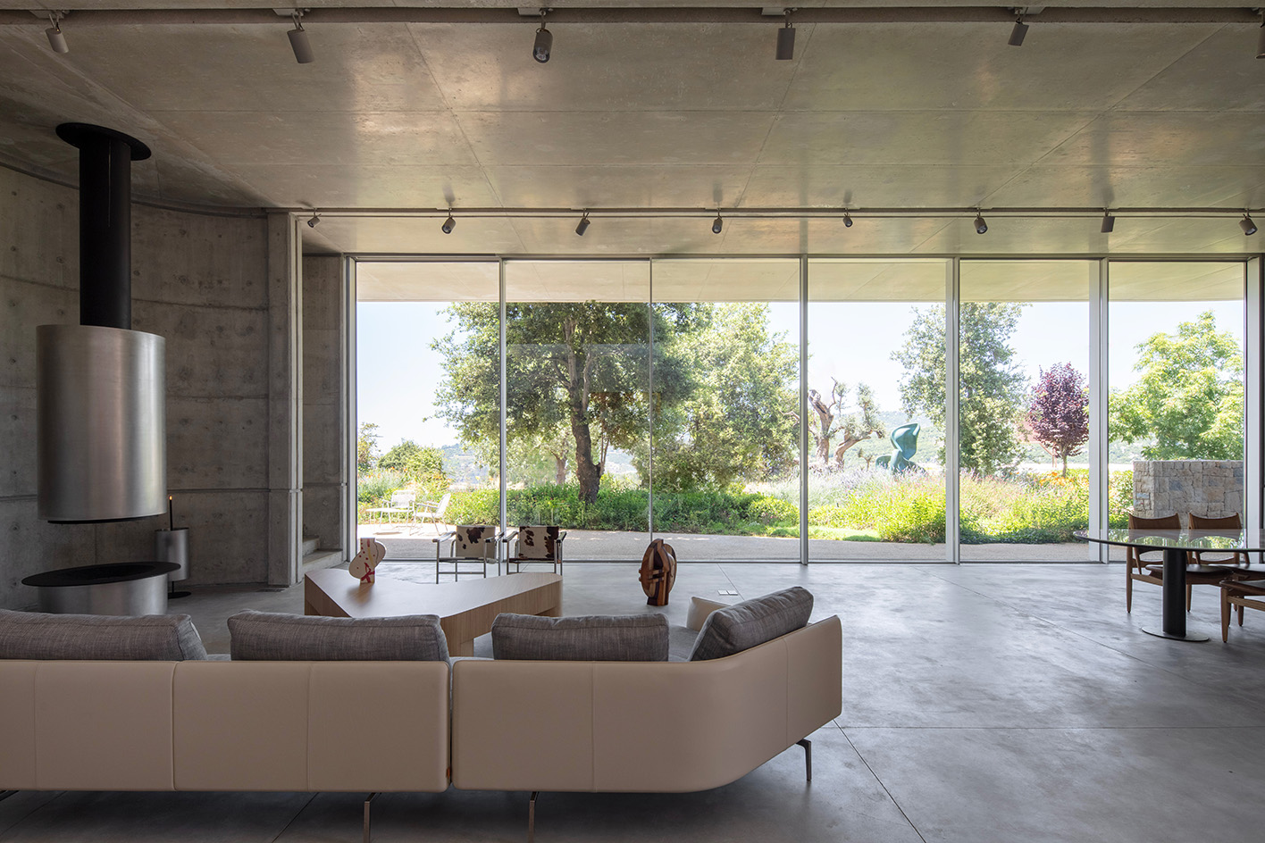 Capsule Retreat by East Architecture Studio, a concrete house in the leafy countryside with tall ceilings and minimalist interiors