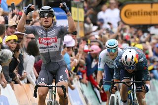 Alpecin-Deceuninck team's Belgian rider Jasper Philipsen cycles to the finish line to win ahead of second-placed Team Visma - Lease a Bike team's Belgian rider Wout Van Aert the 13th stage of the 111th edition of the Tour de France cycling race, 165,3 km between Agen and Pau, southwestern France, on July 12, 2024. (Photo by Marco BERTORELLO / AFP)