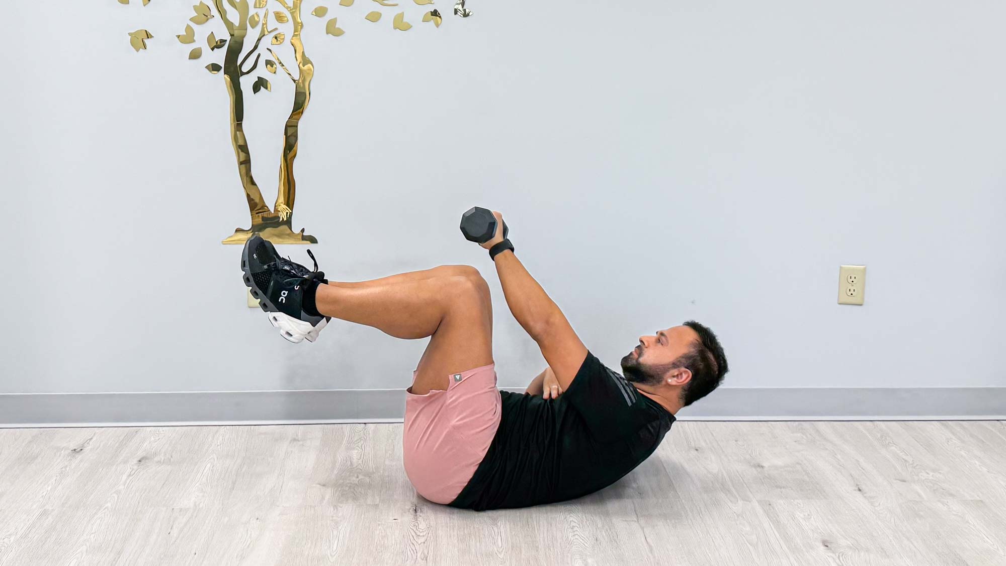 Nico Gonzalez performing the abs curl balance exercise