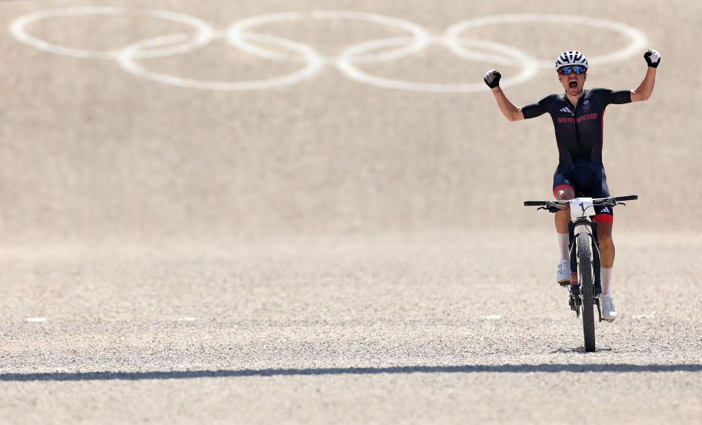 ELANCOURT FRANCE JULY 29 Thomas Pidcock of Team Great Britain celebrates at finish line as gold medal winner during the Mens CrossCountry on day three of the Olympic Games Paris 2024 at Elancourt Hill on July 29 2024 in Elancourt France Photo by Tim de WaeleGetty Images