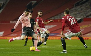 Substitute Oliver Burke fired Sheffield United to victory at Old Trafford on Wednesday