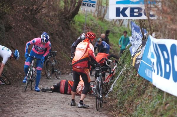 A Lampre rider has to weave through on the climb