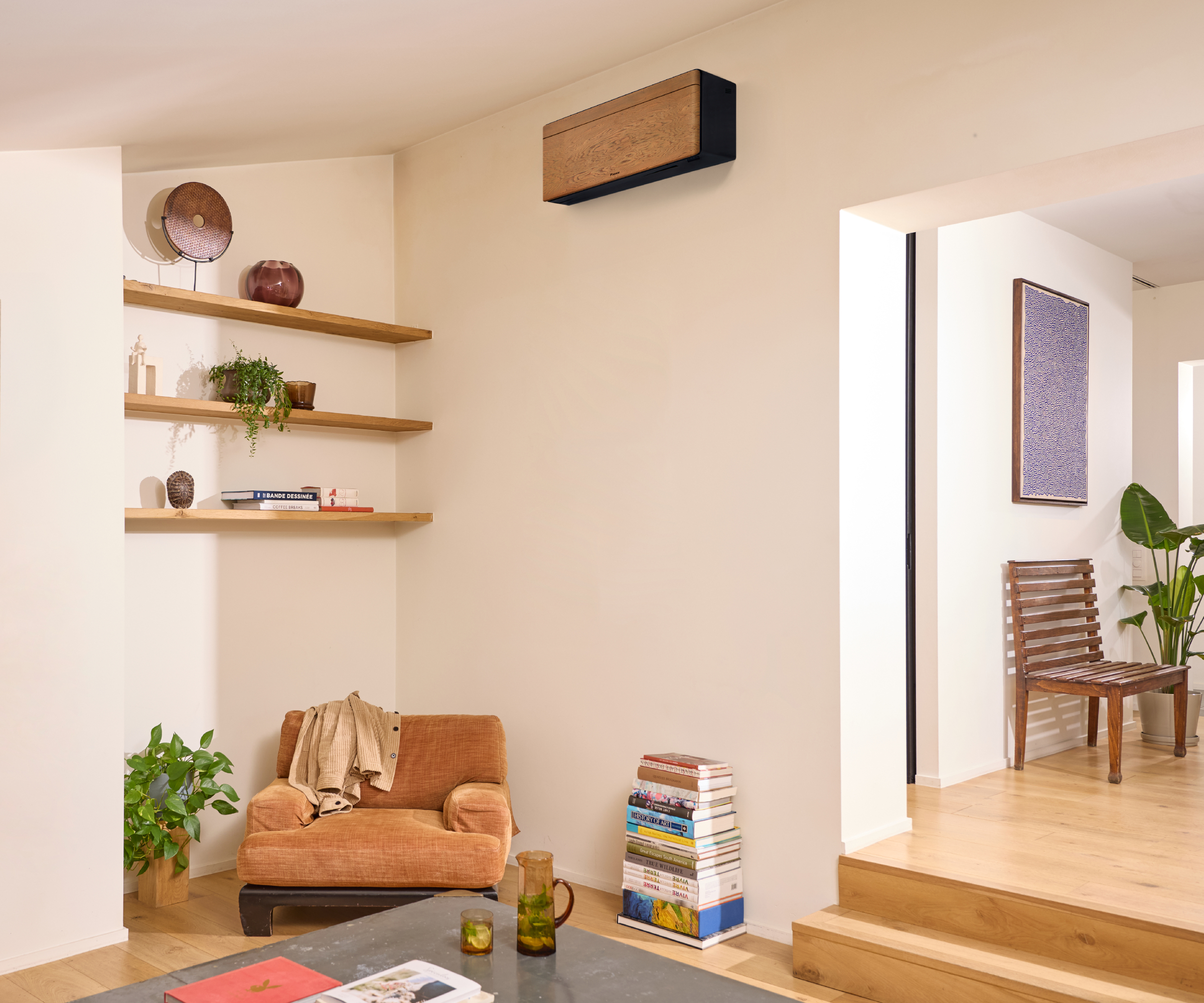 living room with wooden and black air con unit mounted on wall