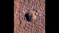 A massive impact crater near the Martian equator revealed blocks of water ice at lower latitudes than have ever been seen before.