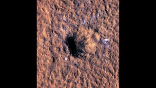 A massive impact crater near the Martian equator revealed blocks of water ice at lower latitudes than have ever been seen before.