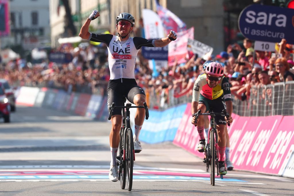 UAE Team Emiratess US rider Brandon McNulty celebrates as he crosses the finish line to win ahead of EF EducationEasyPosts Irish rider Ben Healy R the fifteenth stage of the Giro dItalia 2023 cycling race 195 km between Seregno and Bergamo on May 21 2023 Photo by Luca Bettini AFP Photo by LUCA BETTINIAFP via Getty Images