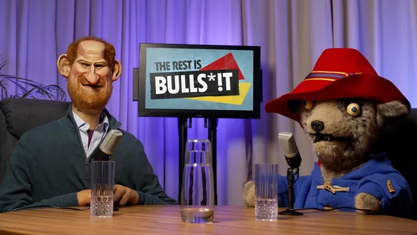 Paddington Bear in Spitting Image next to puppet of Prince Harry and a TV that says &#039;the rest if bulls*!t&#039;