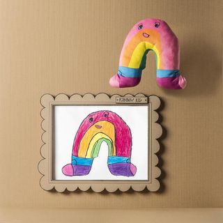 colourful sagoskatt cuddly toy with cardboard frame
