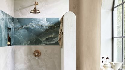 A bathroom shower with contrasting wall tiles 