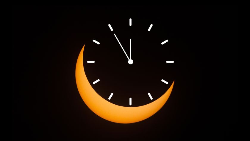 graphic showing a partial solar eclipse whereby the sun appears as a crescent shape, where the moon covers a majority of the sun. Where the moon is located, a clock graphic is situated.