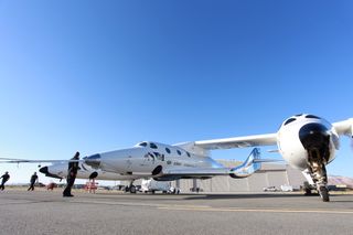 Virgin Galactic’s VSS Unity spacecraft and its carrier airplane, known as WhiteKnightTwo, on the runway before a “glide flight” test on June 1, 2017.