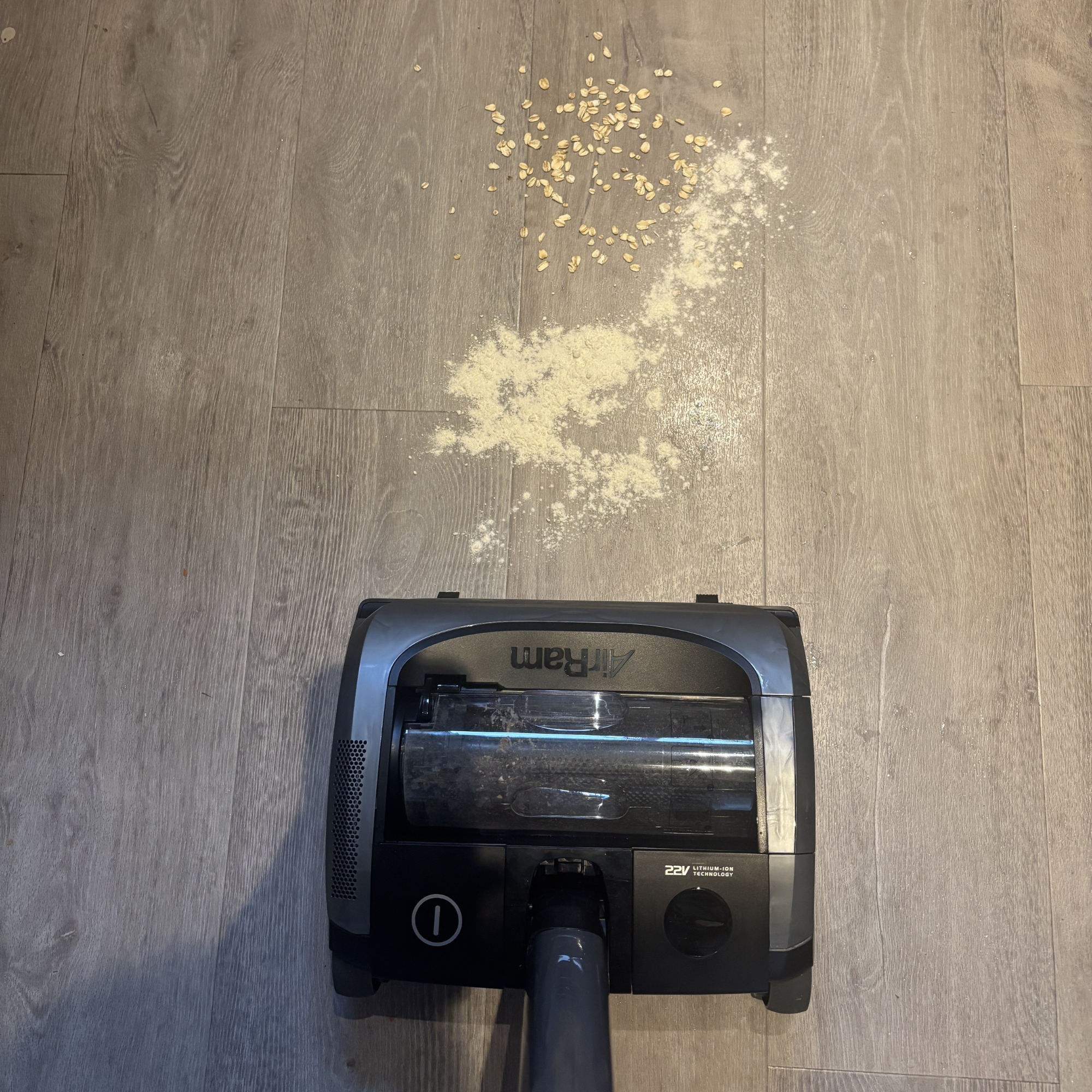 flour and oats spill in front of AirRAM 2 Core Cordless Vacuum
