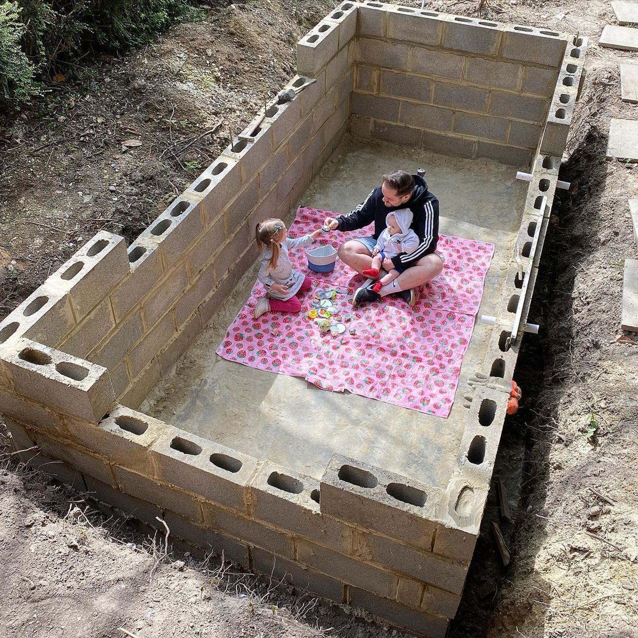 The unfinished pool shows the blocks put in pkace forming the structure of the pool