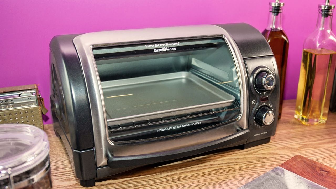 Hamilton Beach Easy Reach 4-Slice Toaster Oven being tested by writer