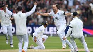  England bowler Ollie Robinson celebrates after taking the wicket of Kane Williamson, caught by Emilio Gay (c) during day one of the 1st Rothesay Test Match between England and New Zealand 