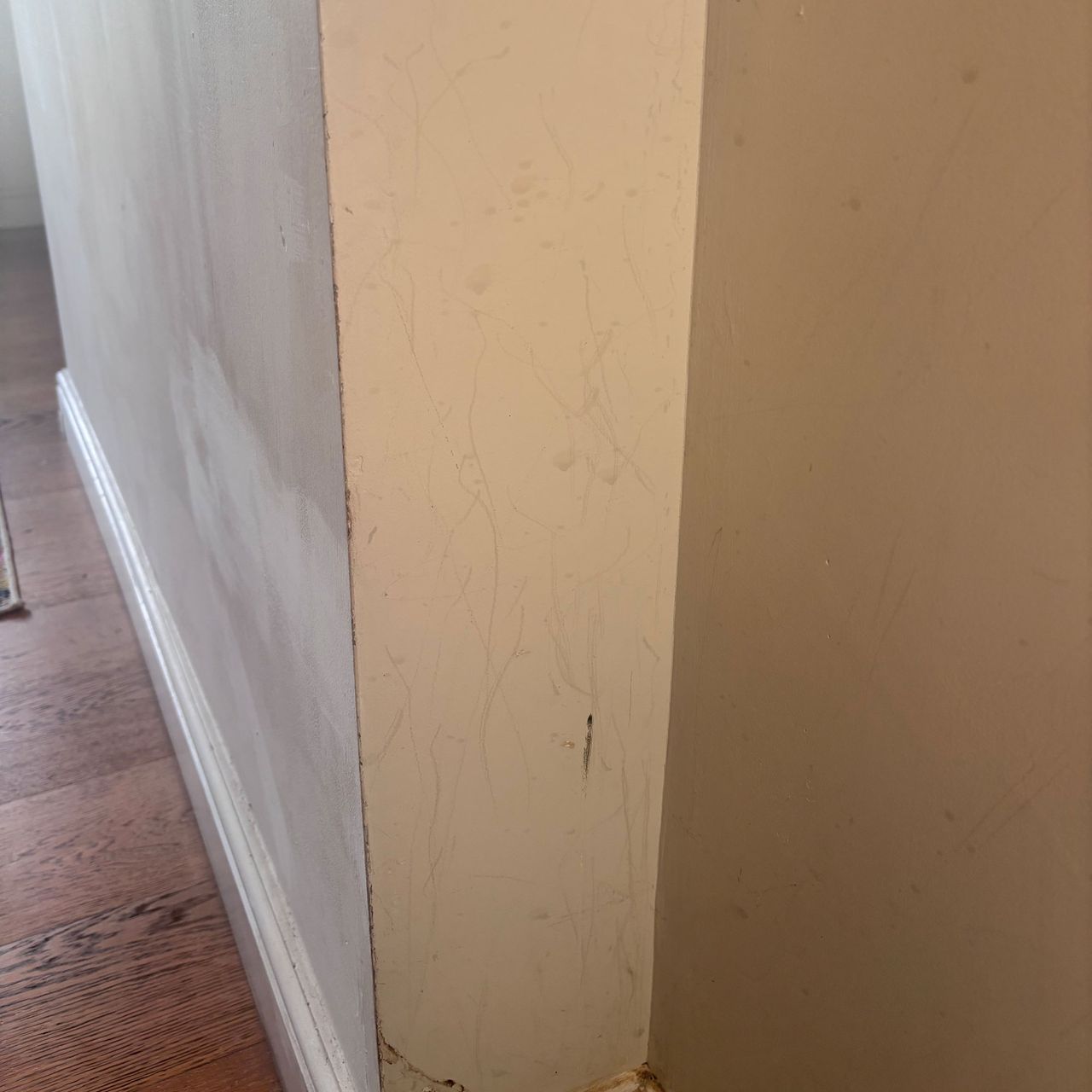 dirty white wall with scratches