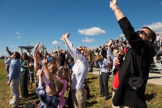 Crowd Watches Antares Rocket Launch