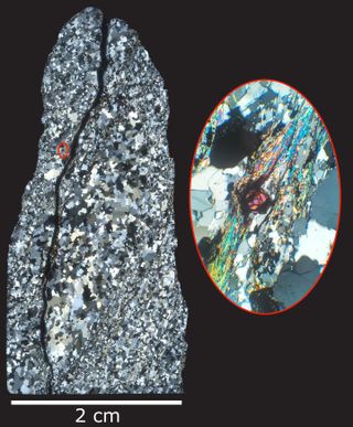 Thin slice of rock collected from the Jack Hills of Western Australia shows the internal structure of quartz that makes up the rock, including ancient zircons (magenta mineral in the center of the red-outlined inset image).