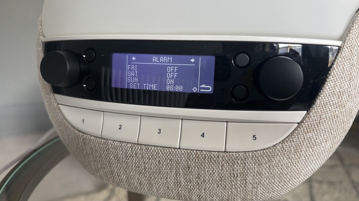 The screen of the Lumie Bodyclock Luxe 700FM sunrise alarm clock displaying the menu for setting an alarm time.