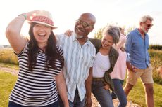 Pre-retirees walking in a field