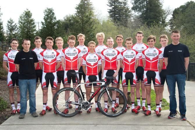 The 14 riders of the Bissell Development team with directors Omer Kem and Axel Merckx.