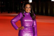 Oprah smiling at a red carpet event