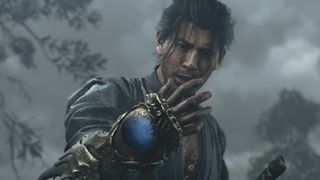 Musashi examines the oni gauntlet with a confused expression in Onimusha: Way of the Sword