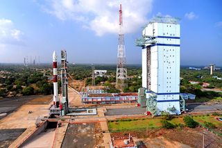 This panoramic view shows India's PSLV-C20 rocket on the First Launch Pad with the Mobile Service Tower at a distance. The rocket will launch seven satellites into orbit on Feb. 25, 2013, from the Satish Dhawan Space Centre in Sriharikota, India.
