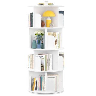 A white, tall and rotating bookshelf is full of books and other objects 