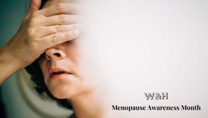 Woman holding hand to head, representing insomnia in menopause