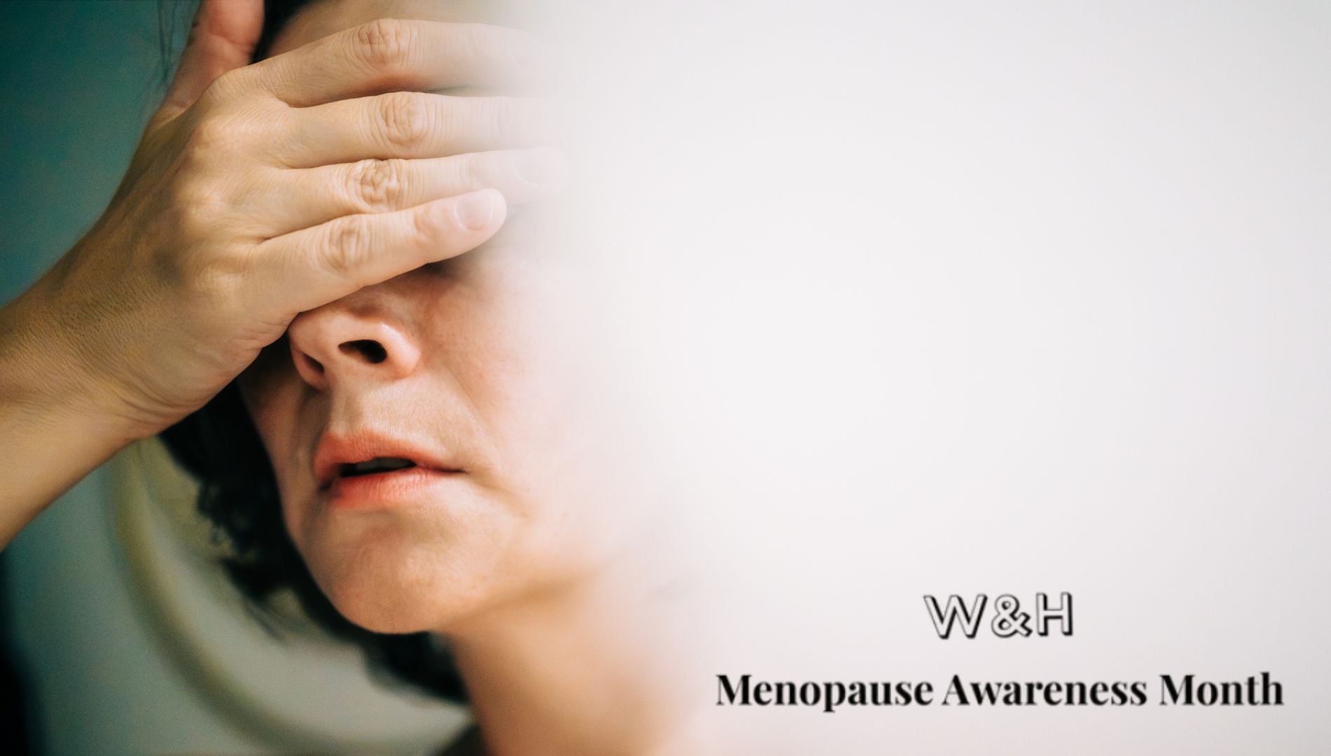 Woman holding hand to head, representing insomnia in menopause