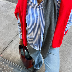 woman wearing cuffed denim outfit with striped button down shirt