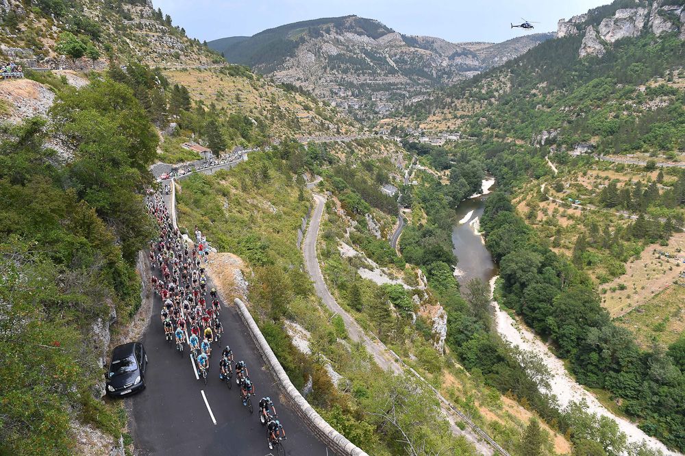 The peloton rolls through the French countryside during stage 14.
