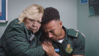 Heartbroken Teddy in tears on Jan's shoulder in Casualty.